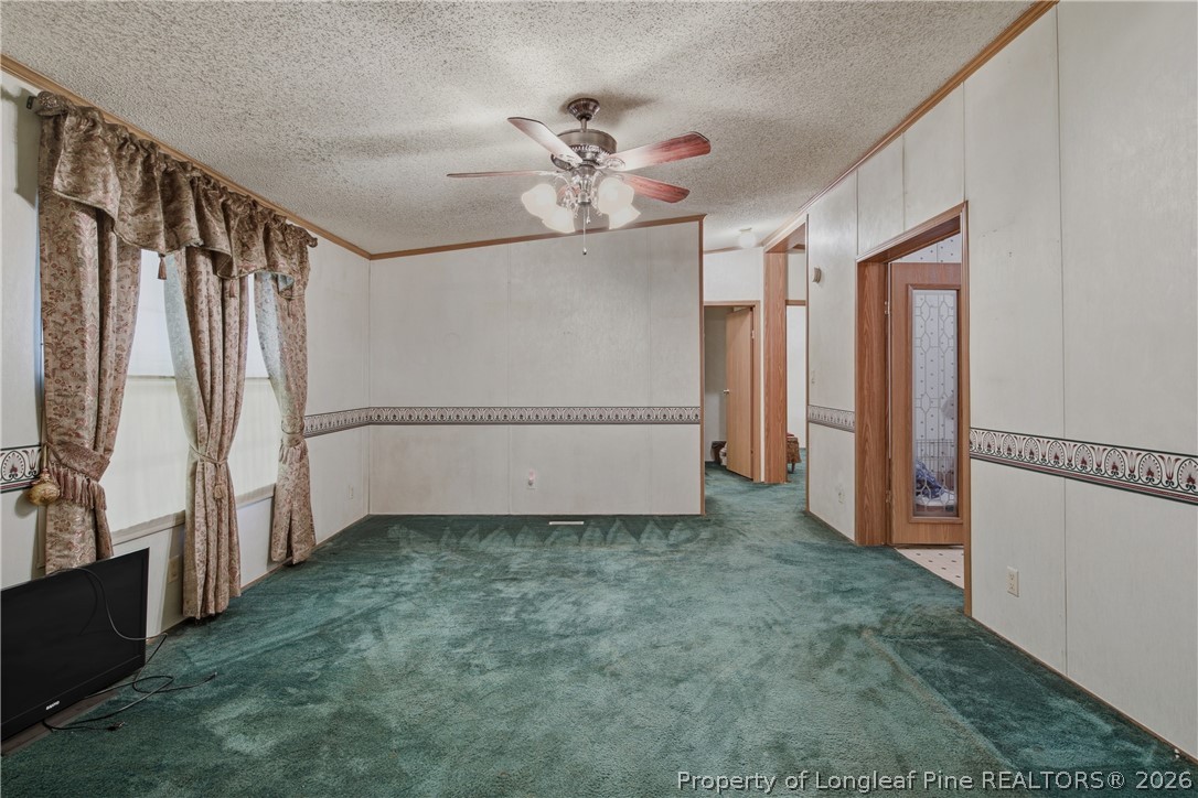 7307 Roslin Farm Road Hope Mills, NC 28348 - Photo 9 of 46 a view of a livingroom with a staircase