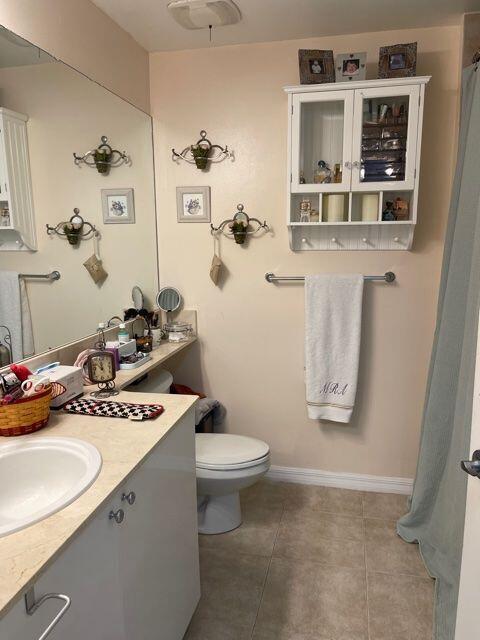 233 South Federal Highway, Unit 301 Boca Raton, FL 33432 - Photo 11 of 30 a bathroom with a sink toilet and mirror