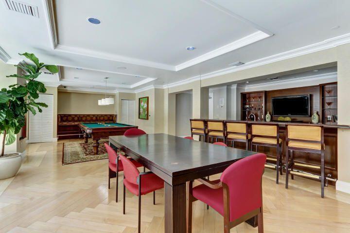 233 South Federal Highway, Unit 301 Boca Raton, FL 33432 - Photo 17 of 30 a dining room with furniture and a flat screen tv