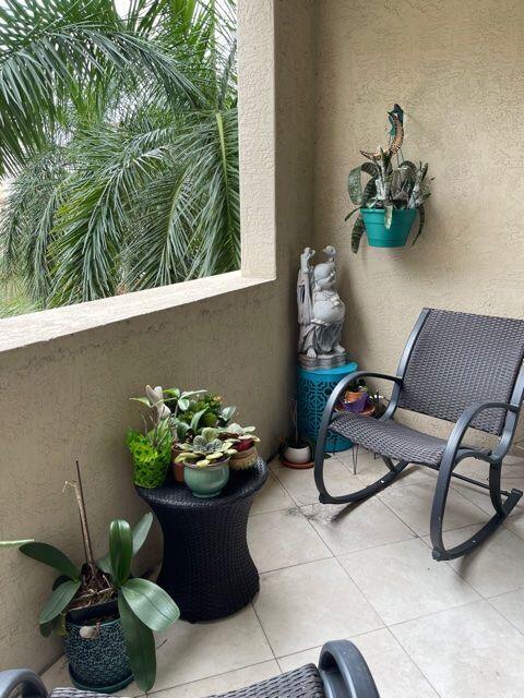 233 South Federal Highway, Unit 301 Boca Raton, FL 33432 - Photo 20 of 30 a vase of flowers sitting on a floor
