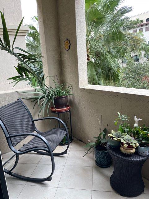 233 South Federal Highway, Unit 301 Boca Raton, FL 33432 - Photo 21 of 30 a view of a porch with furniture and a potted plant