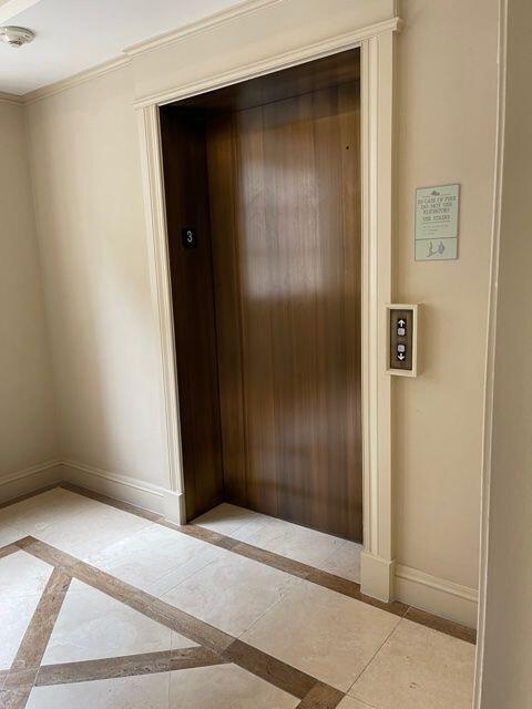 233 South Federal Highway, Unit 301 Boca Raton, FL 33432 - Photo 22 of 30 an empty room with wooden door