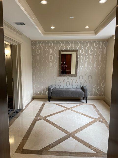 233 South Federal Highway, Unit 301 Boca Raton, FL 33432 - Photo 23 of 30 a bedroom with a bed and a flat screen tv