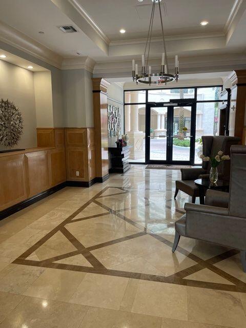 233 South Federal Highway, Unit 301 Boca Raton, FL 33432 - Photo 25 of 30 a lobby with furniture and a chandelier