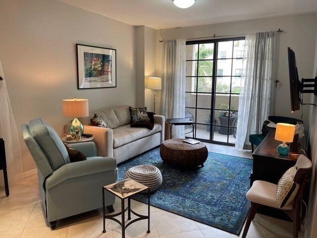 233 South Federal Highway, Unit 301 Boca Raton, FL 33432 - Photo 4 of 30 a living room with furniture and a flat screen tv