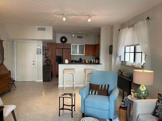 233 South Federal Highway, Unit 301 Boca Raton, FL 33432 - Photo 6 of 30 a living room with furniture and a flat screen tv
