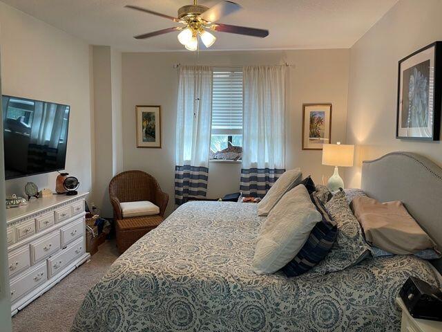 233 South Federal Highway, Unit 301 Boca Raton, FL 33432 - Photo 9 of 30 a bedroom with two beds and a flat screen tv