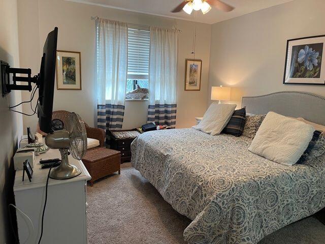 233 South Federal Highway, Unit 301 Boca Raton, FL 33432 - Photo 10 of 30 a bedroom with a bed couch and a window