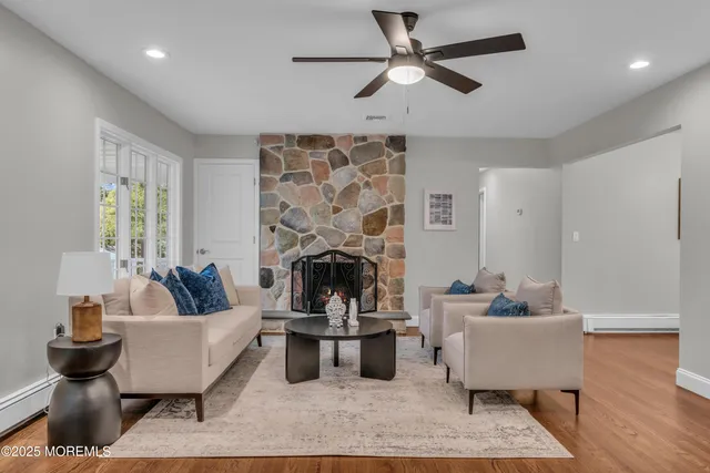 a living room with furniture and a fireplace