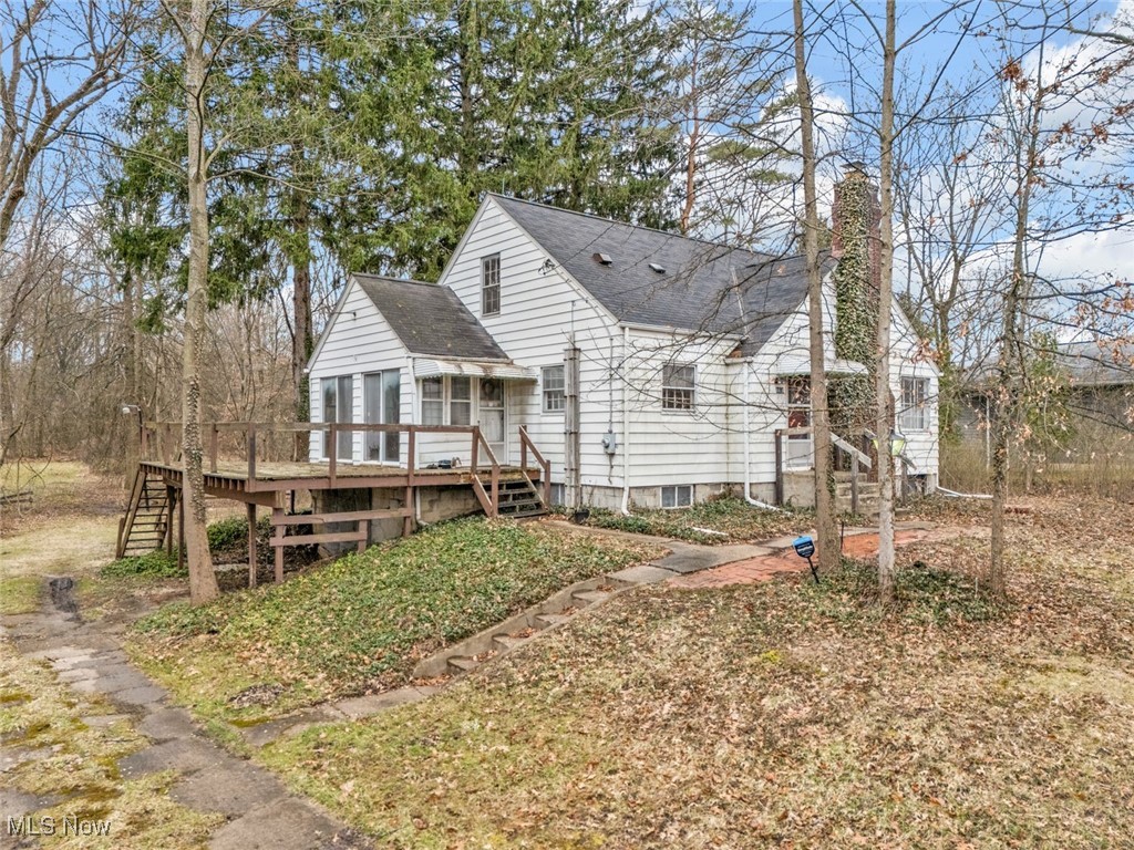 4468 Fishcreek Road Stow, OH 44224 - Photo 1 of 38 Back of property featuring roof with shingles, stairway, a deck, and a chimney