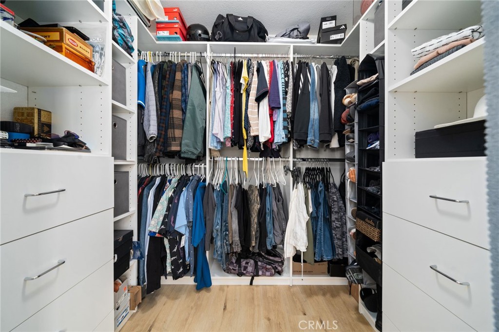 1237 East 6th Street, Unit 201 Long Beach, CA 90802 - Photo 14 of 27 a view of walk in closet with clothes