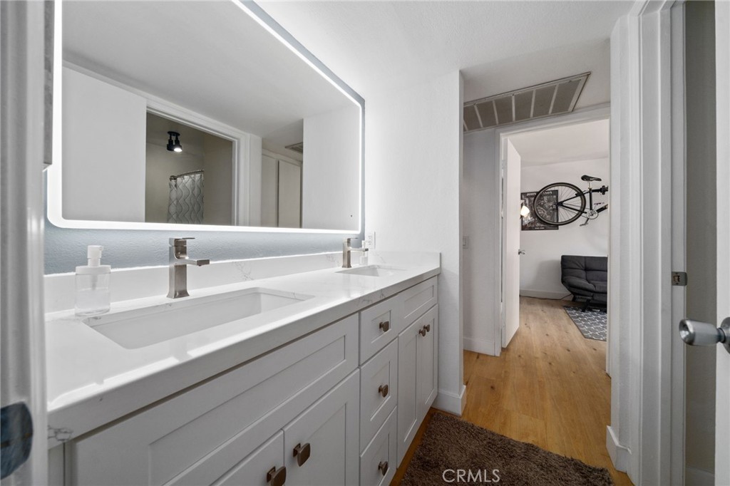1237 East 6th Street, Unit 201 Long Beach, CA 90802 - Photo 15 of 27 a en suite bathroom with a sink and mirror