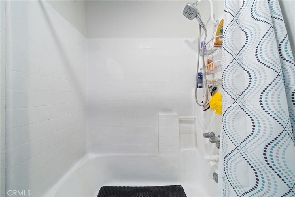 1237 East 6th Street, Unit 201 Long Beach, CA 90802 - Photo 16 of 27 a bathroom with a bathtub and shower