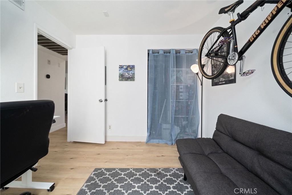 1237 East 6th Street, Unit 201 Long Beach, CA 90802 - Photo 18 of 27 a living room with furniture