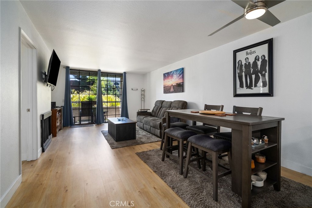 1237 East 6th Street, Unit 201 Long Beach, CA 90802 - Photo 2 of 27 a view of a dining room with furniture window and wooden floor