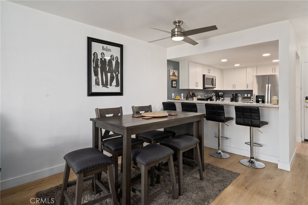 1237 East 6th Street, Unit 201 Long Beach, CA 90802 - Photo 7 of 27 a view of a dining room with furniture