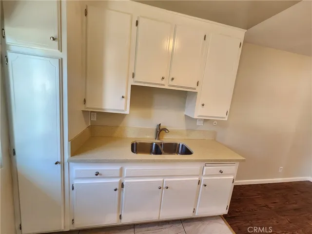 a kitchen with a sink and cabinets