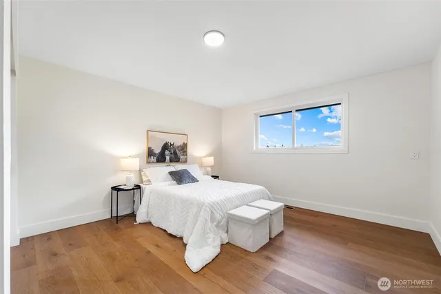 a bathroom with a sink mirror vanity and toilet