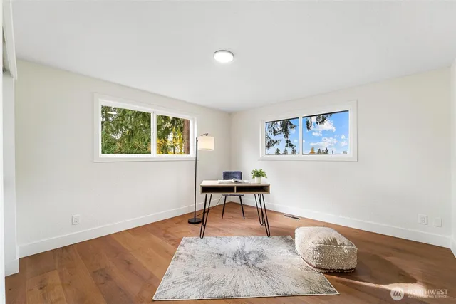 a bedroom with a bed and a couch