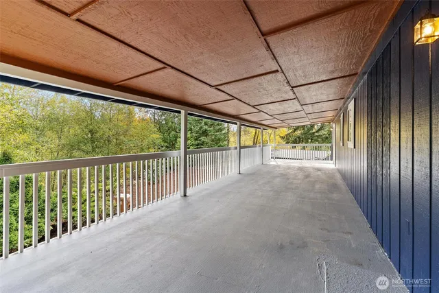 a view of a room with wooden walls