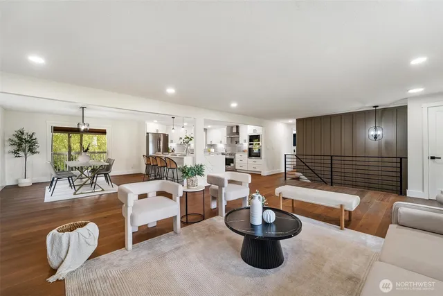 a dining room with furniture window and wooden floor