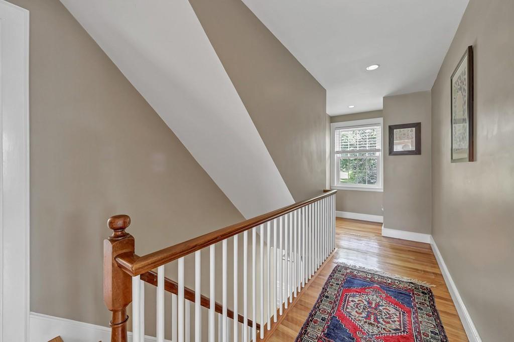 150 Edge Hill Road Milton, MA 02186 - Photo 10 of 22 a view of entryway with stairs and wooden floor