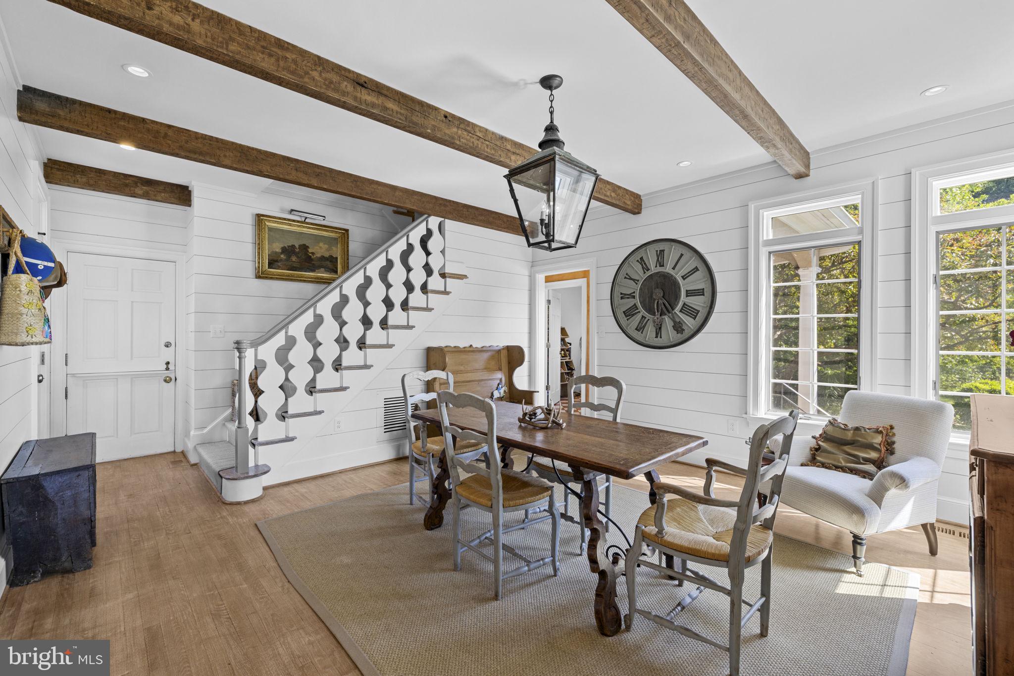 36190 Turkey Roost Road Middleburg, VA 20117 - Photo 28 of 88 a view of a dining room with furniture and a large window