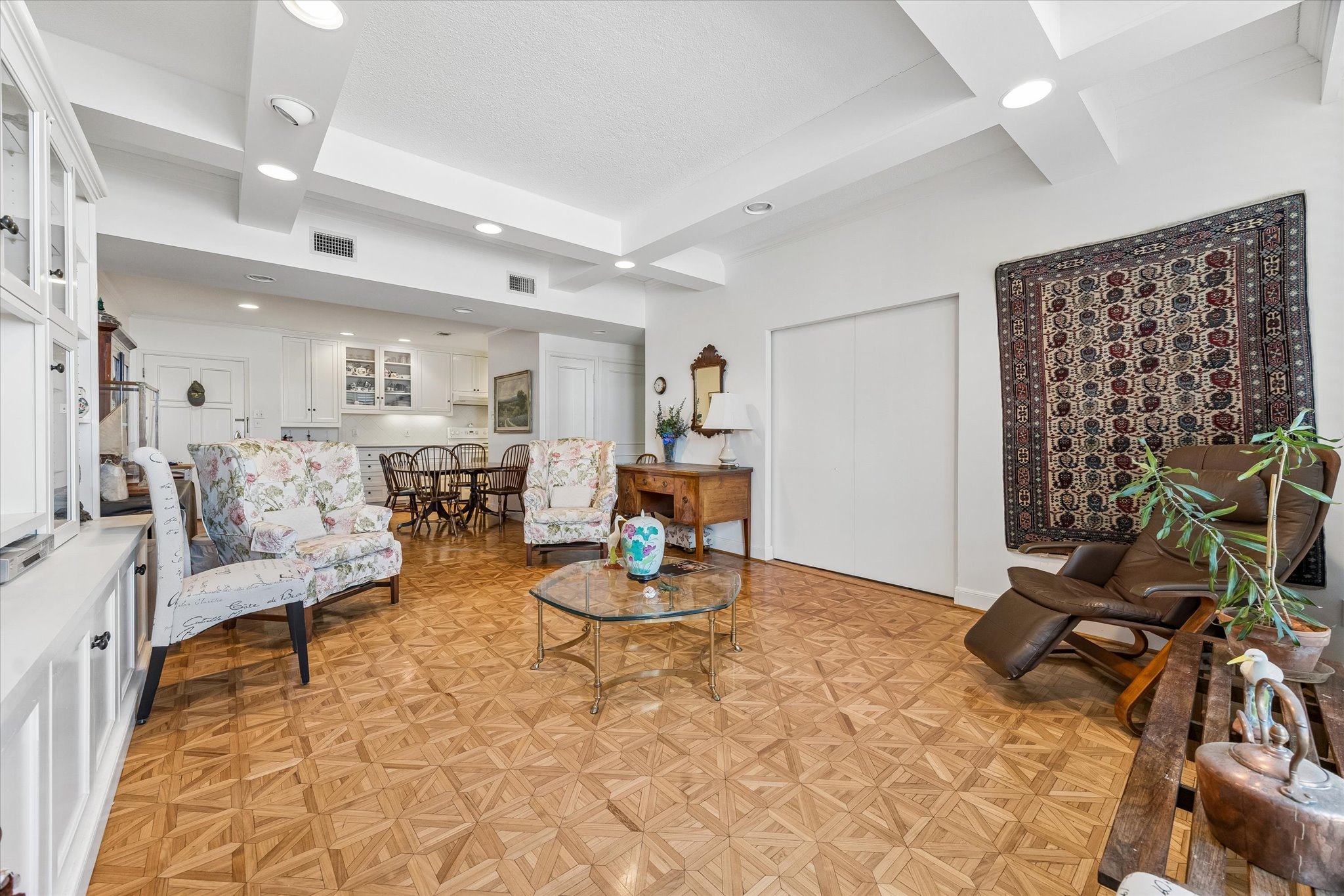 1801 Lavaca Street, Unit 6E Austin, TX 78701 - Photo 4 of 32 Living room featuring coffered ceiling, parquet floors, and recessed lighting