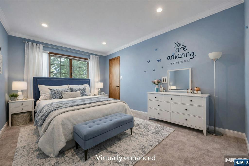 44 West Midland Avenue Paramus, NJ 07652 - Photo 14 of 19 a spacious bedroom with a bed and a window