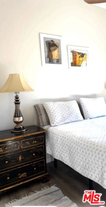 1710 Decker Road Malibu, CA 90265 - Photo 11 of 23 a bedroom with a bed and a lamp