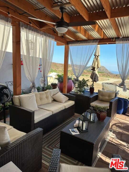 1710 Decker Road Malibu, CA 90265 - Photo 14 of 23 a living room with furniture and a large window