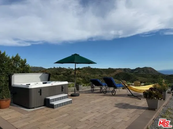 swimming pool view with a seating space