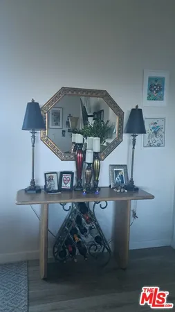 a living room with furniture and a lamp