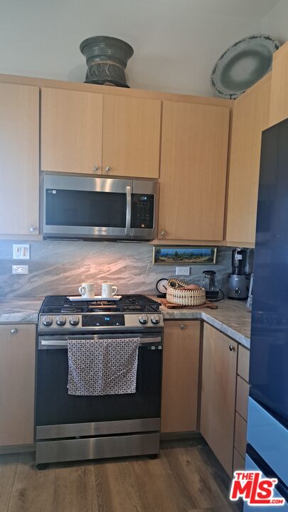 1710 Decker Road Malibu, CA 90265 - Photo 7 of 23 a stove top oven sitting inside of a kitchen
