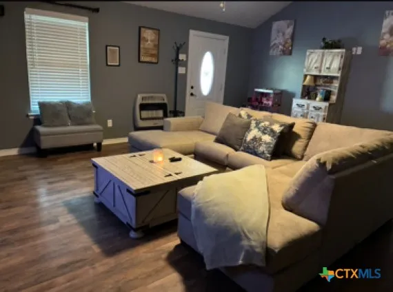 a living room with furniture and a couch