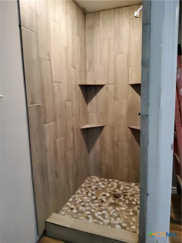 a view of a storage & utility room with washer and dryer