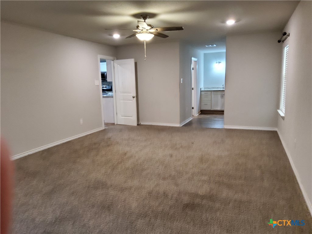 1601 County Road 153 Evant, TX 76525 - Photo 21 of 25 an empty room with fan and entrance