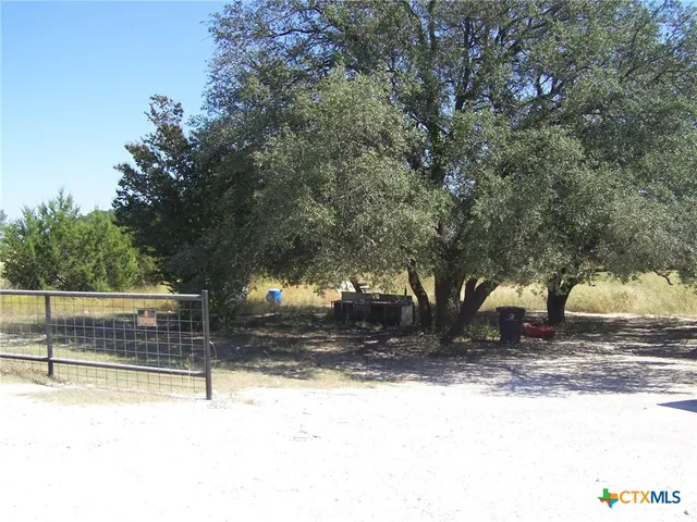 a view of a yard covered with snow in the yard