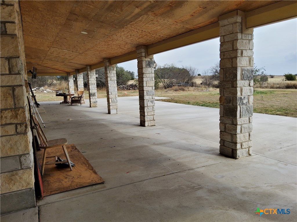 1601 County Road 153 Evant, TX 76525 - Photo 9 of 25 a view of a hall with wooden floor