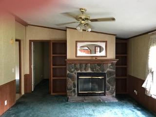267 Running Meadows Road Portland, TN 37148 - Photo 13 of 25 a living room with furniture and a fireplace