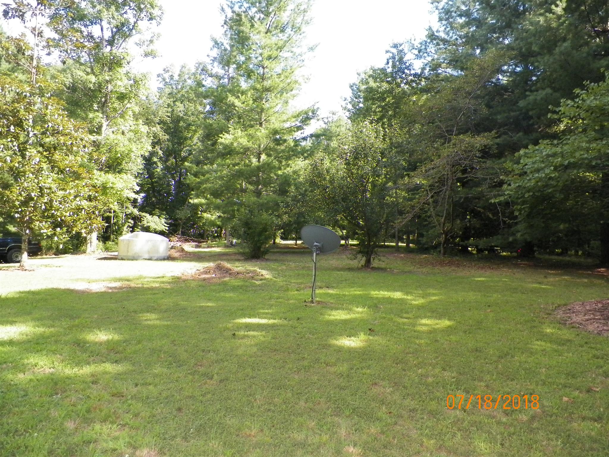 267 Running Meadows Road Portland, TN 37148 - Photo 16 of 25 a swimming pool with outdoor seating and yard
