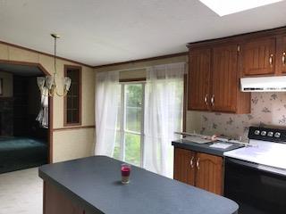 267 Running Meadows Road Portland, TN 37148 - Photo 10 of 25 a kitchen with stainless steel appliances granite countertop a refrigerator a sink dishwasher a stove and a refrigerator with wooden floor