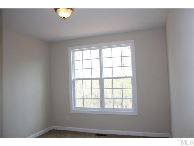 2804 Bending Tree Court Raleigh, NC 27613 - Photo 9 of 25 First Floor Guest Suite with Frieze Carpet, Overhead Light, Closet with Custom Shelving, Access to Private Bath! Bedroom