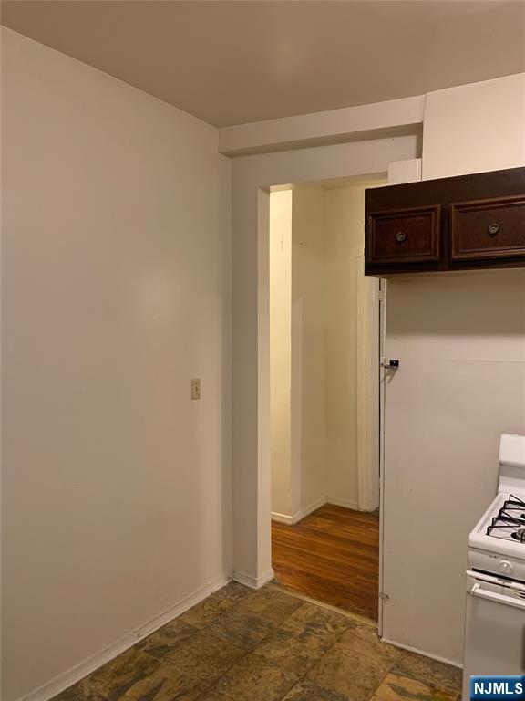 5616 Hudson Avenue, Unit 1D West New York, NJ 07093 - Photo 3 of 11 a view of a hallway with wooden floor and closet