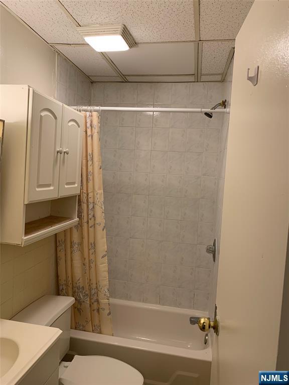5616 Hudson Avenue, Unit 1D West New York, NJ 07093 - Photo 9 of 11 a bathroom with a bathtub and a shower