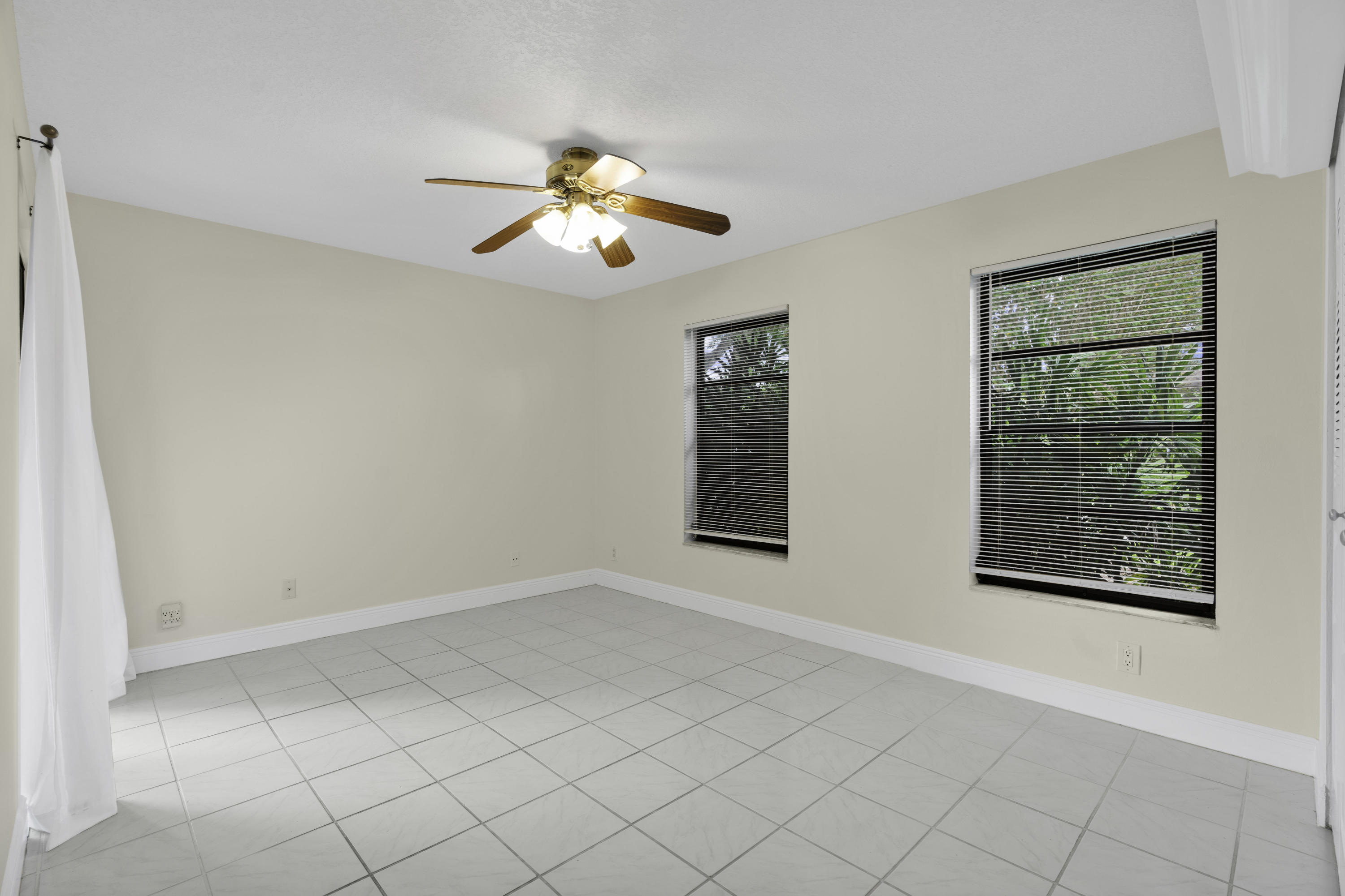 3375 Northwest 27th Avenue Boca Raton, FL 33434 - Photo 14 of 27 a view of an empty room with a window