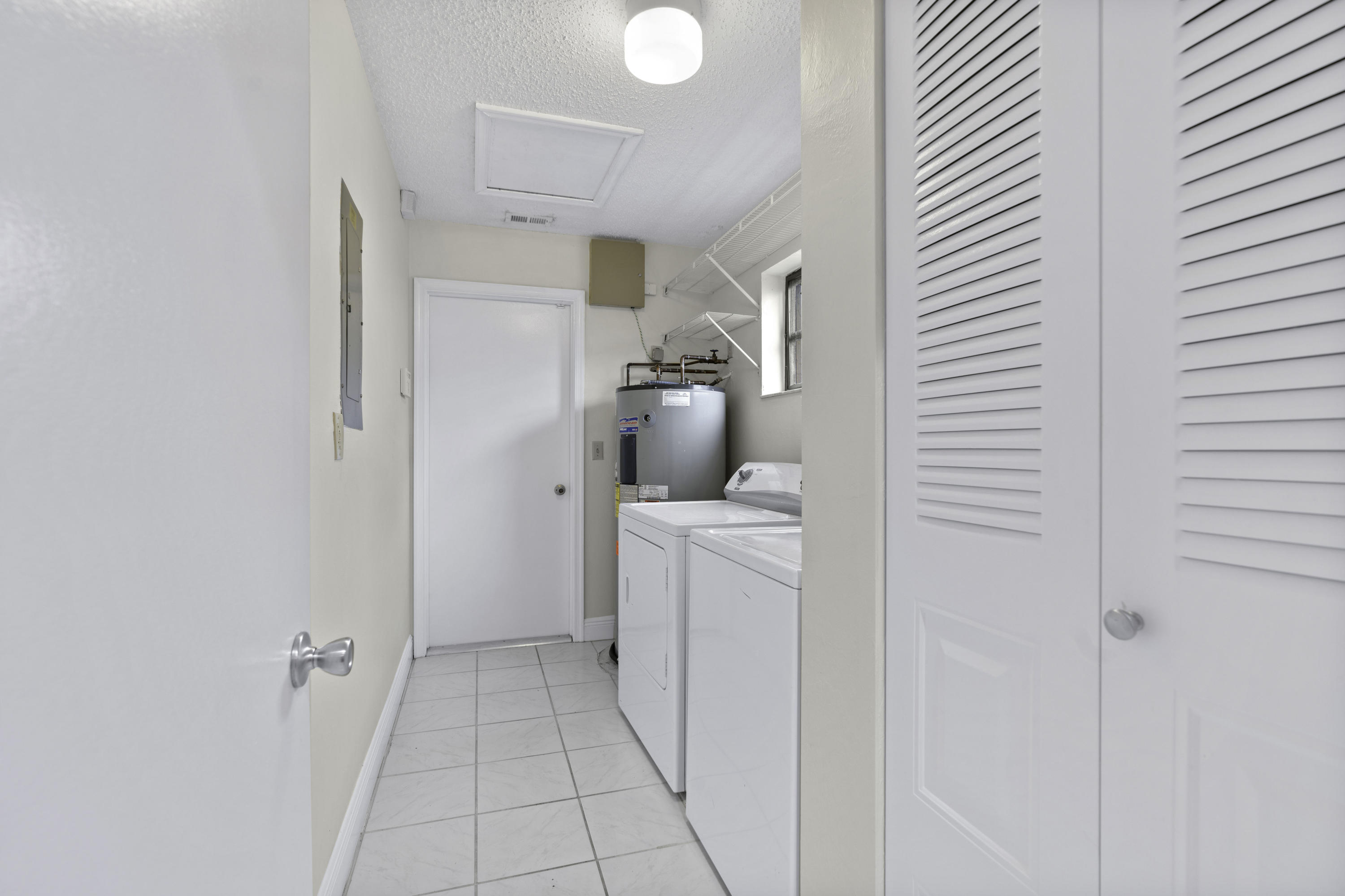 3375 Northwest 27th Avenue Boca Raton, FL 33434 - Photo 15 of 27 a bathroom with a sink and a mirror