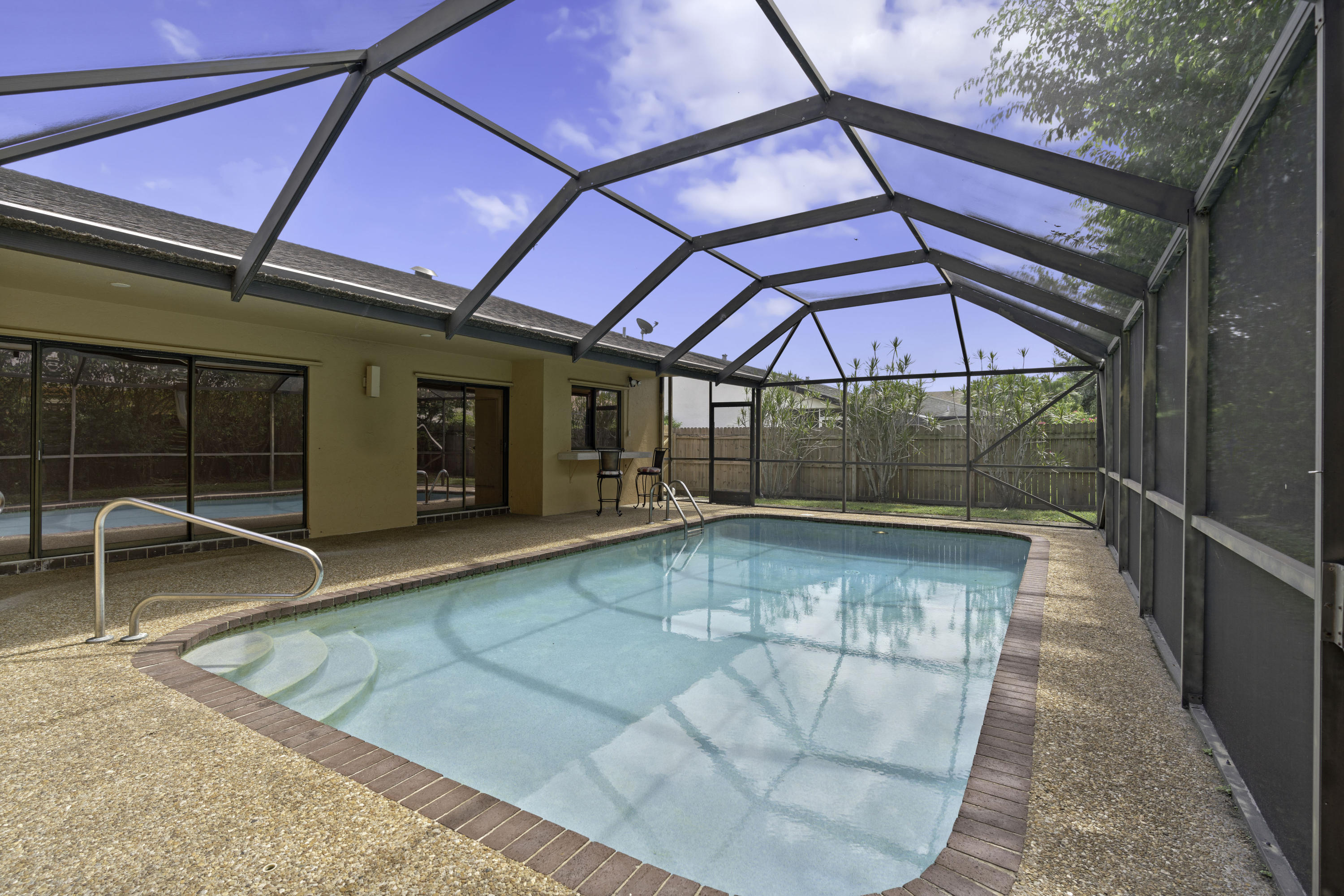 3375 Northwest 27th Avenue Boca Raton, FL 33434 - Photo 3 of 27 a view of a indoor swimming pool