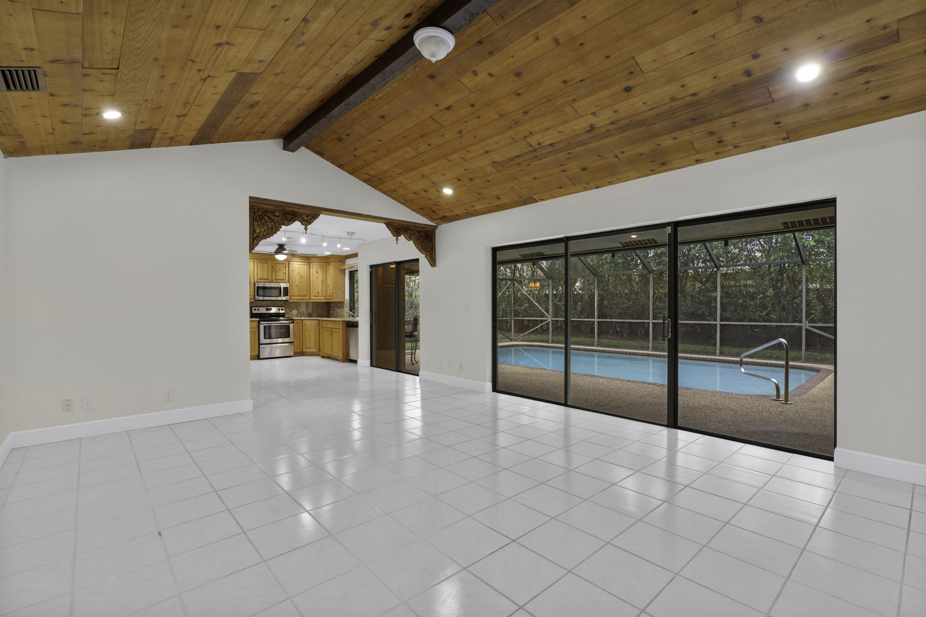 3375 Northwest 27th Avenue Boca Raton, FL 33434 - Photo 6 of 27 a view of an empty room with windows