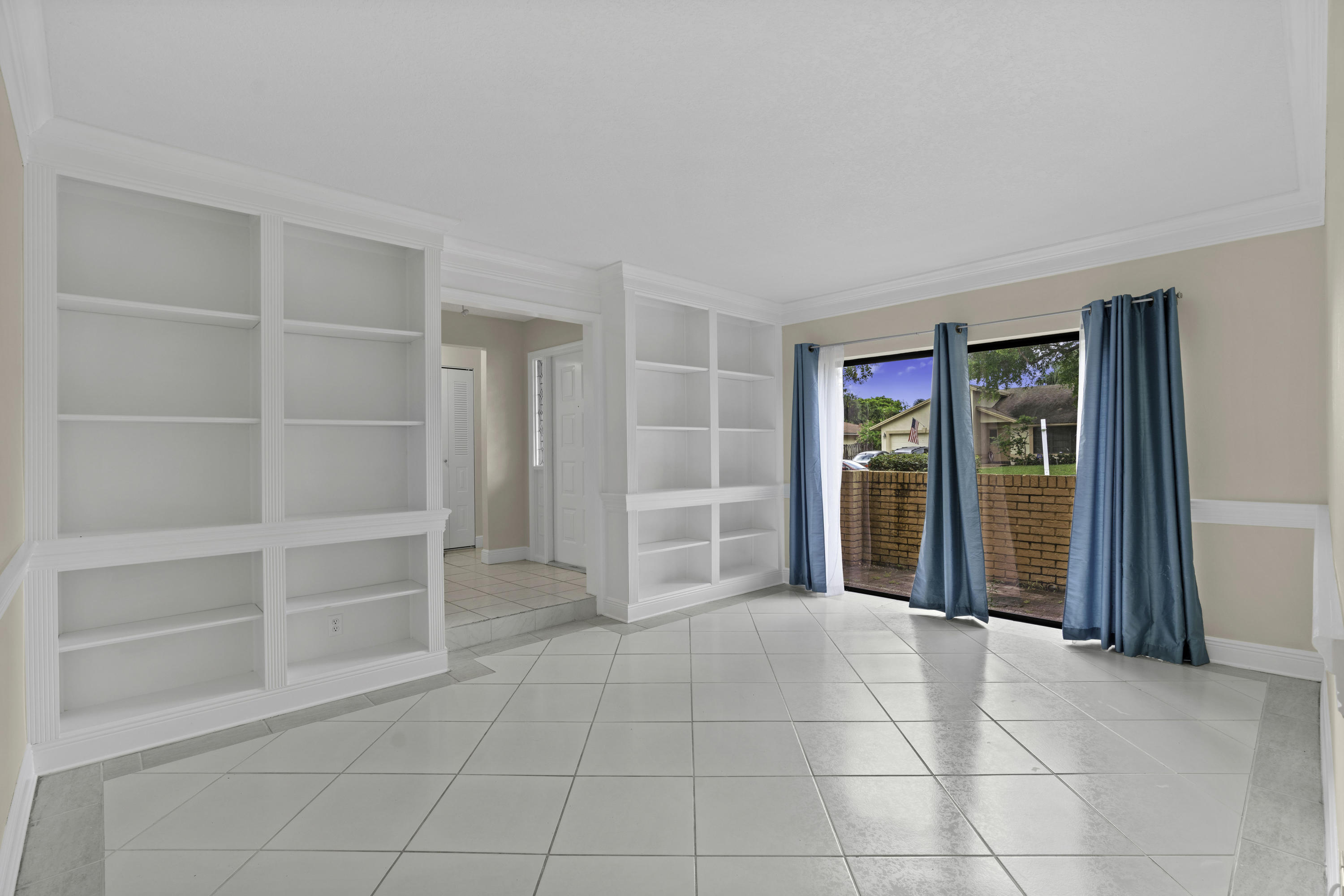 3375 Northwest 27th Avenue Boca Raton, FL 33434 - Photo 8 of 27 a view of an empty room with a window